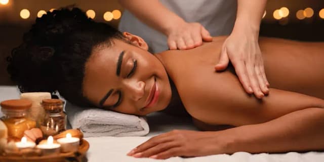 60 Minute Swedish or Deep Tissue Massage with Hot Stones (Includes Organic Aroma Oil and Cupping) (Valid M-Th)